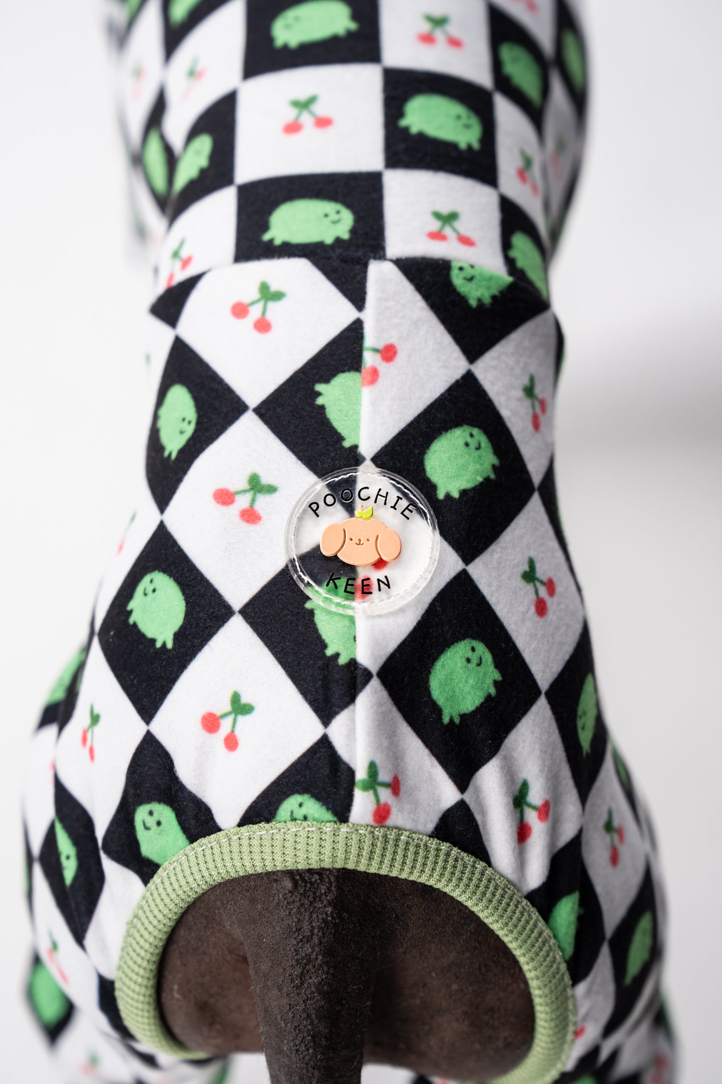 logo on a Playful frog-print pajamas on a Whippet, made for sighthounds with narrow builds.