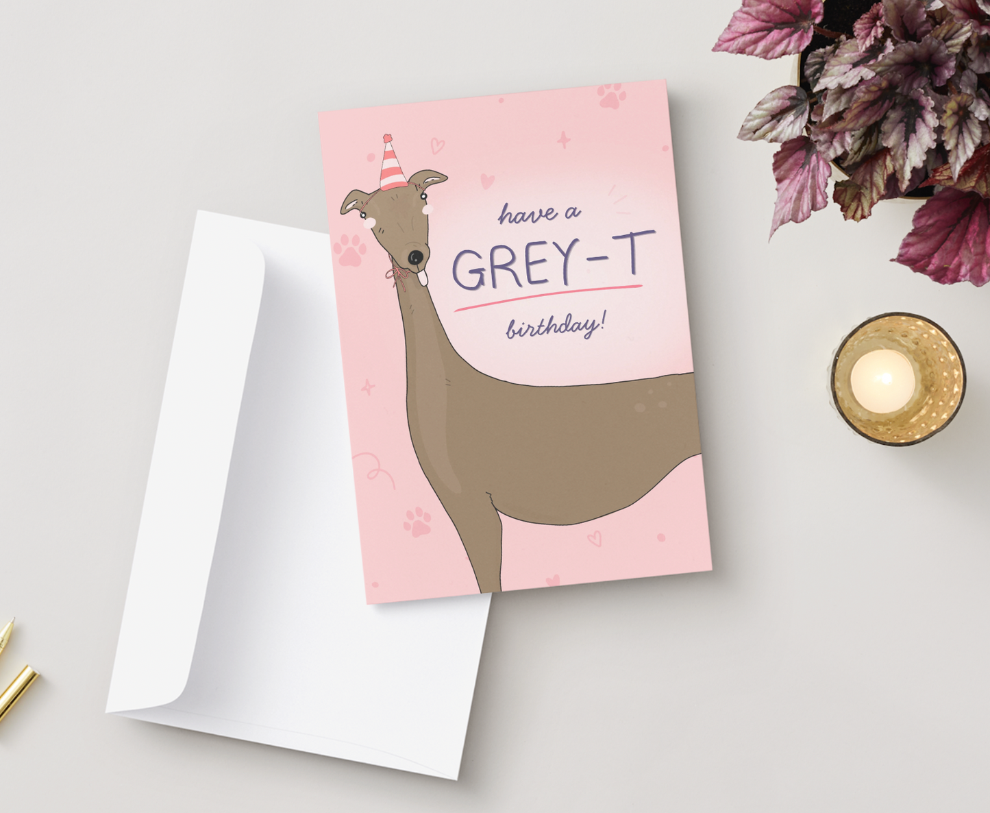 Pastel pink greyhound birthday greeting card with the quote “Have a GREY-T Birthday!”